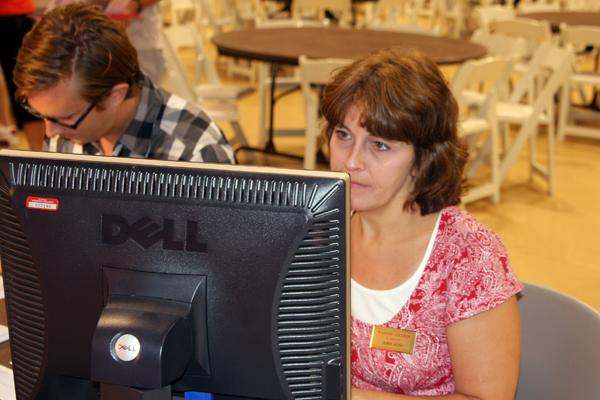 a woman looking at a computer screen