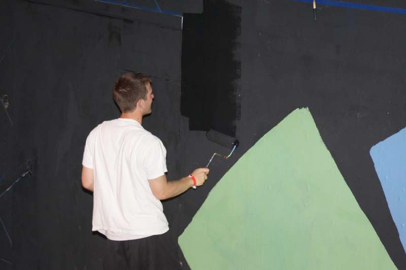 a man painting a wall