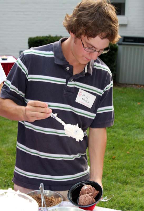 a man holding a cake