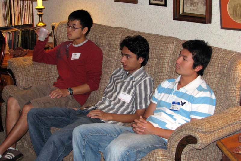 a group of men sitting on a couch