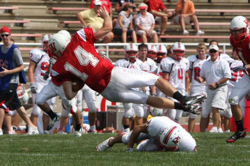 a football player diving into the air