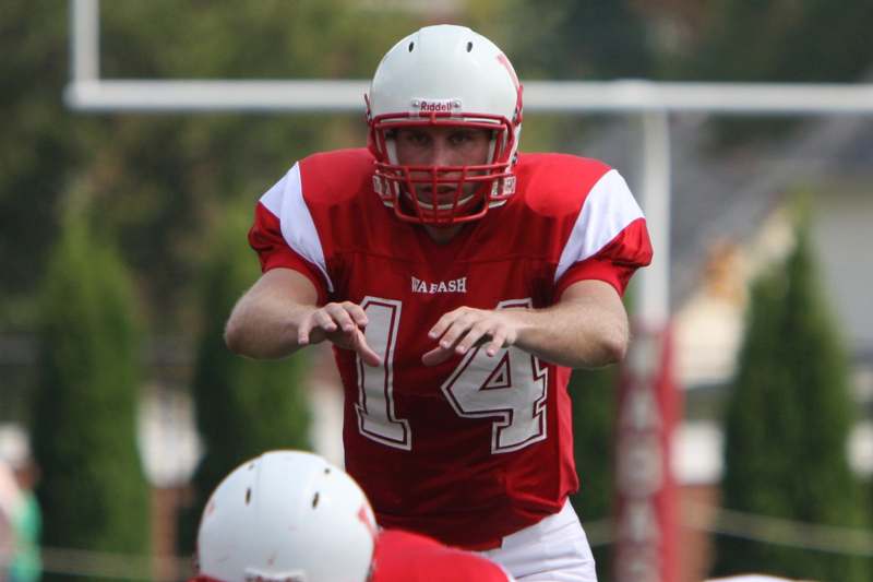 a football player in a red uniform