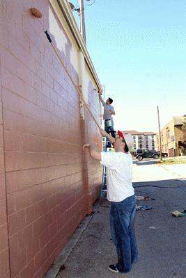 a man painting a wall