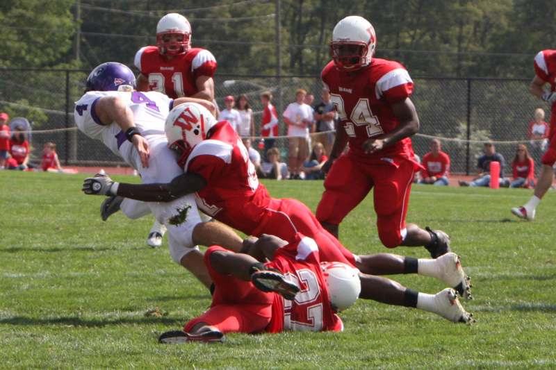 a football player falling into the ground