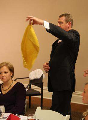 a man holding a yellow cloth