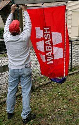 a man holding a red banner