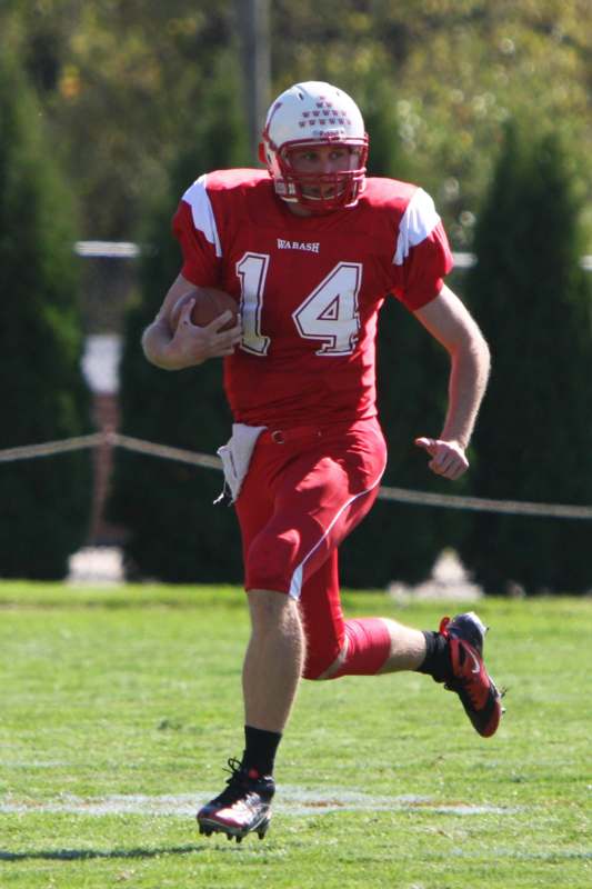 a football player running with a football