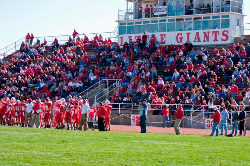 a football team in red shirts on a field
