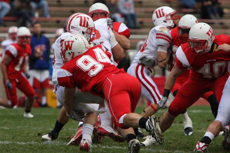 a football players in red and white uniforms
