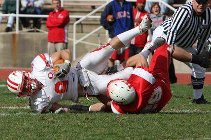 a football players falling over