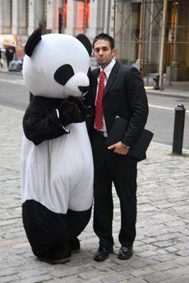a man in a suit and a garment of a panda