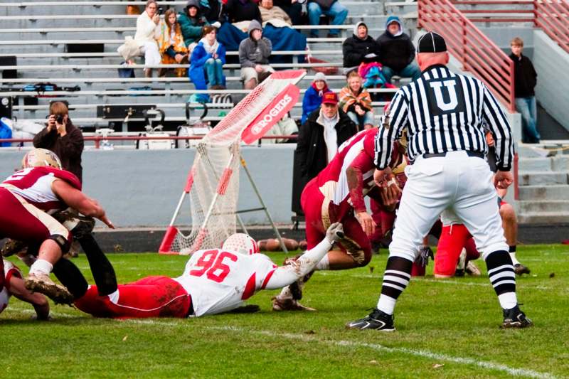 a football player falling off the ground