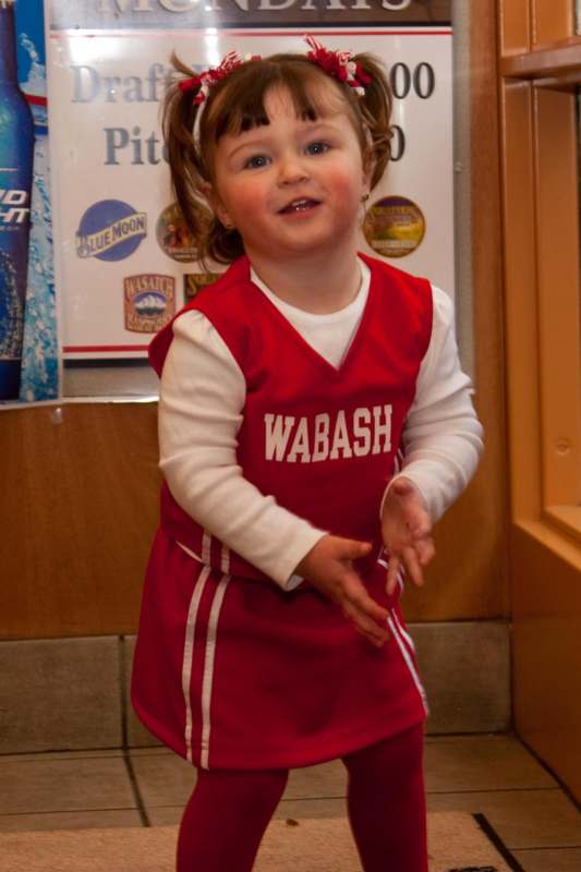 a child in a red uniform