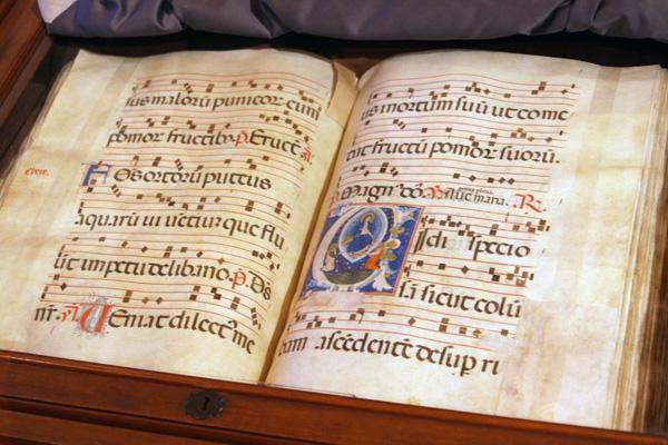 an open book with music notes