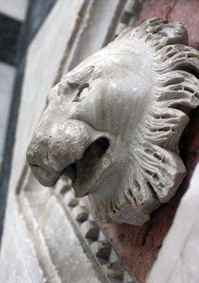 a stone lion head sculpture