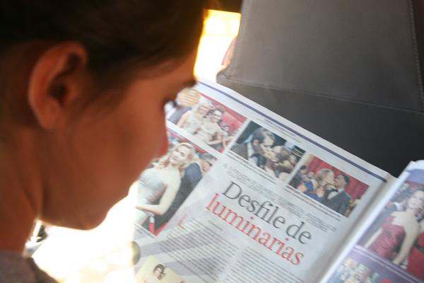 a woman reading a newspaper