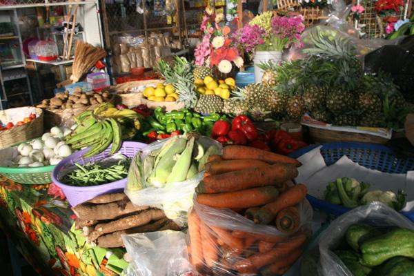 a market with many different fruits and vegetables