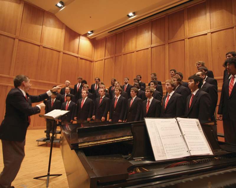 a man standing in front of a choir