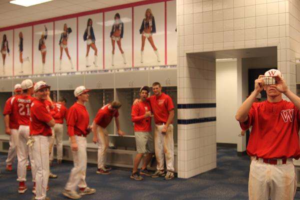 a group of people in a locker room