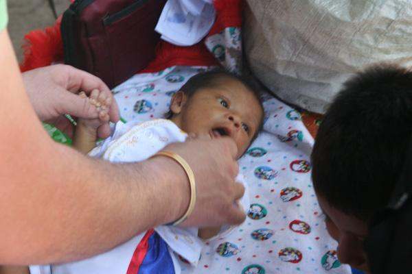 a baby being held by a person