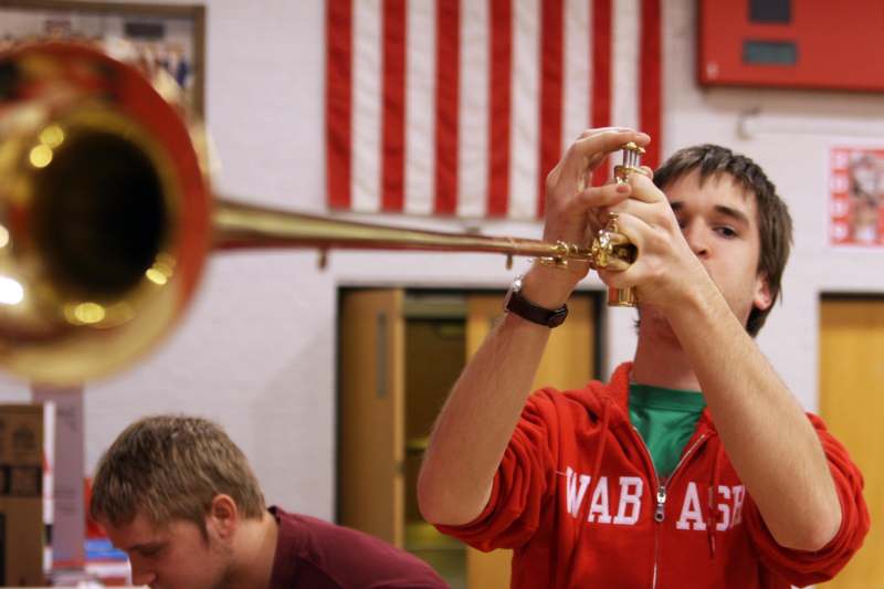a man holding a trumpet