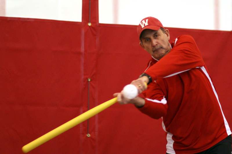 a man swinging a baseball bat