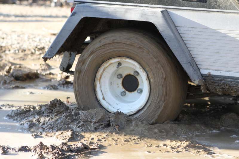 a tire on a vehicle in mud