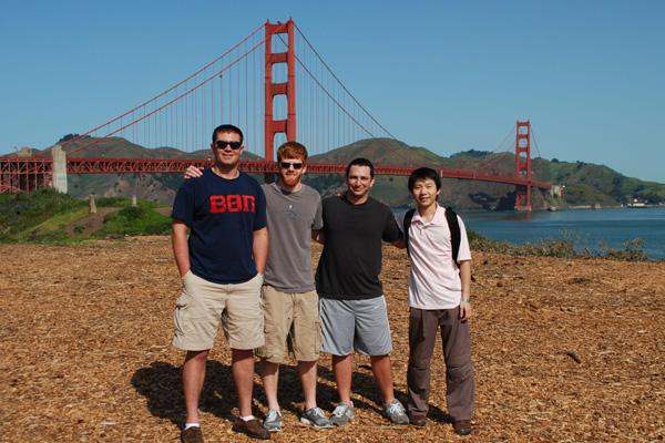 a group of men posing for a picture