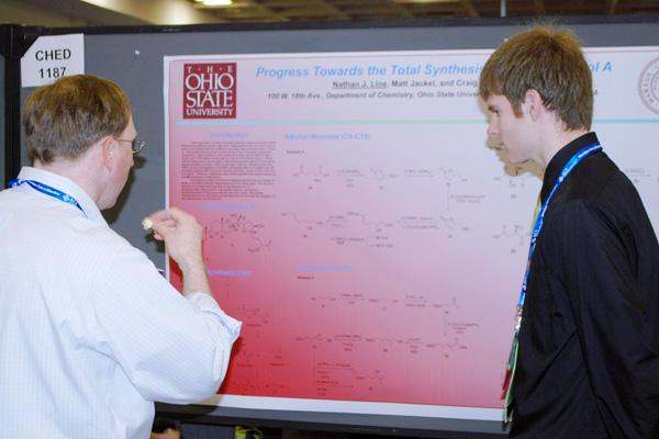 a man showing a diagram to another man