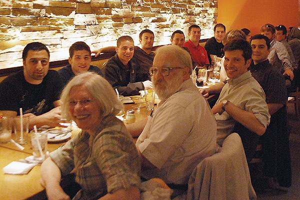 a group of people sitting at a table