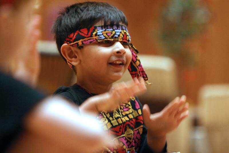 a child wearing a colorful bandana
