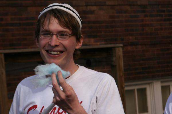 a man eating a cotton candy