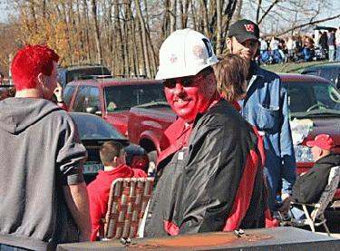 a man wearing a hard hat and red paint