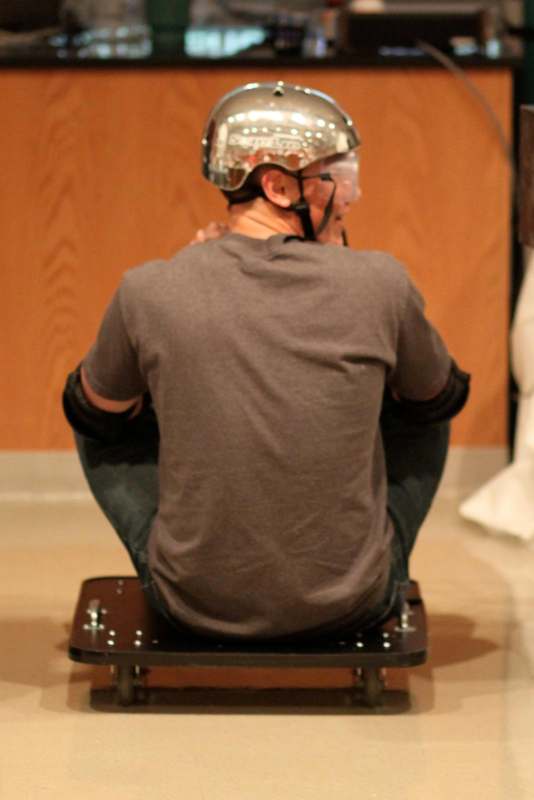 a man wearing a helmet and kneel down