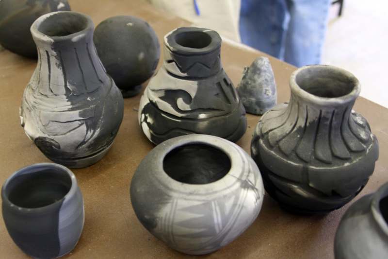 a group of black and white vases