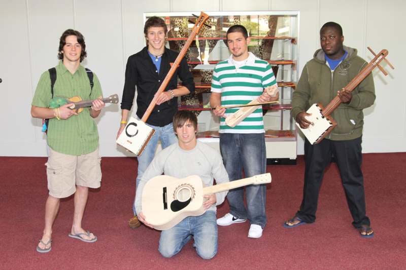 a group of men holding guitars