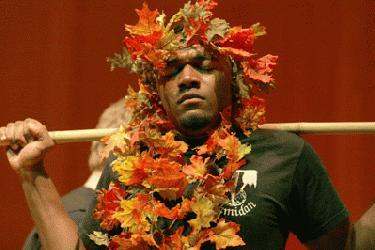 a man wearing a wreath of leaves