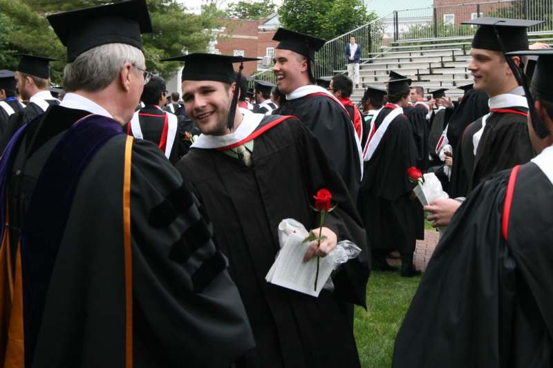 a group of graduates in graduation gowns