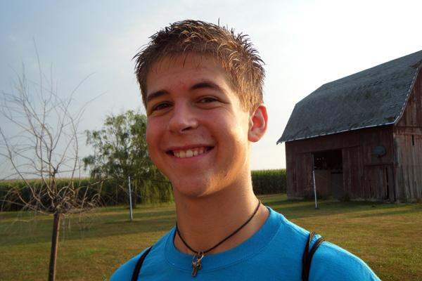 a man smiling for a picture