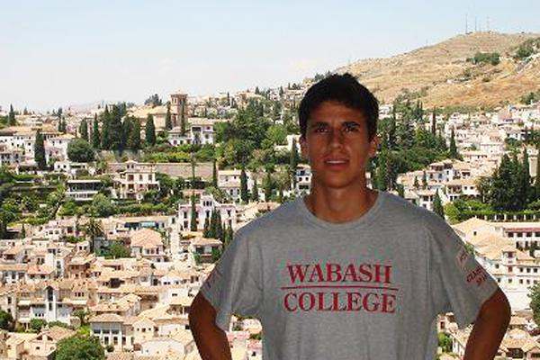 a man standing in front of a city