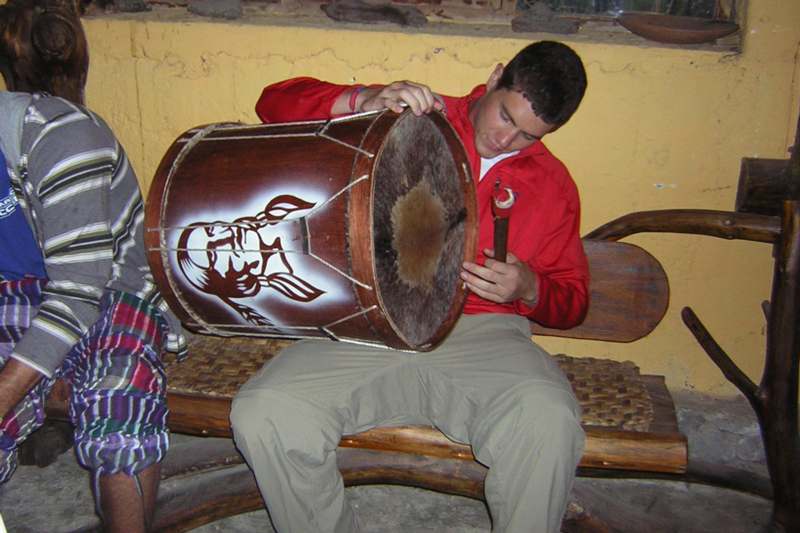 a man playing a drum