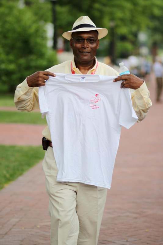 a man holding a white shirt