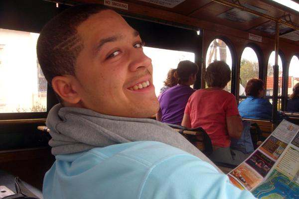a man smiling in a bus