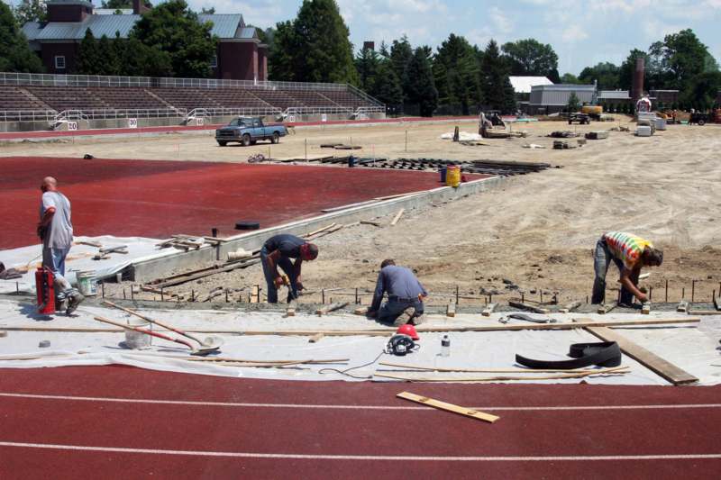a few men working on a track
