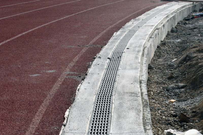 a drainage grate on a track