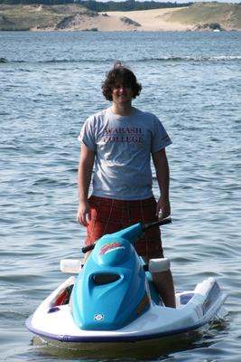 a man standing on a jet ski