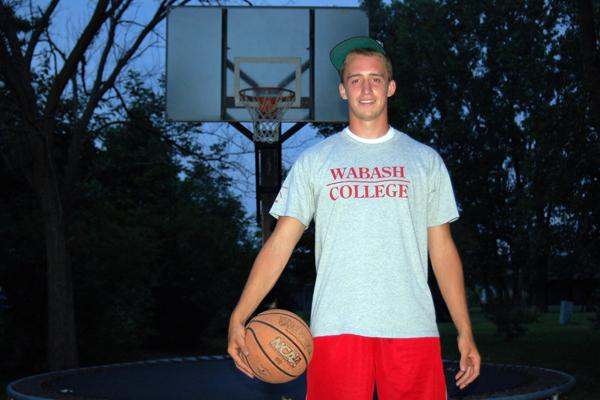 a man holding a basketball