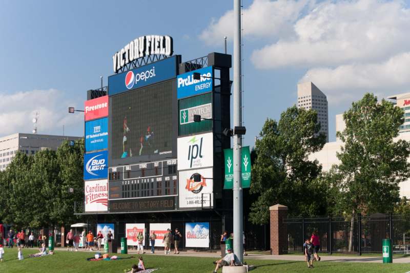 a large scoreboard with many advertisements