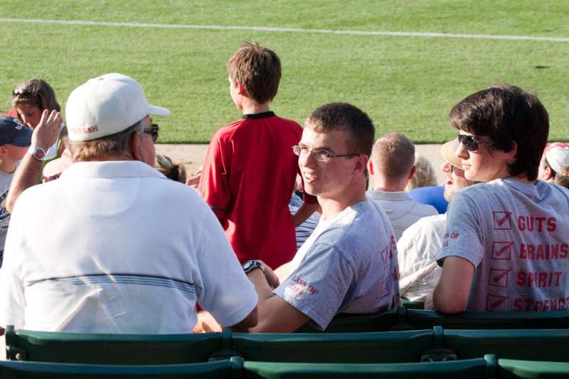 a group of people sitting in a stadium