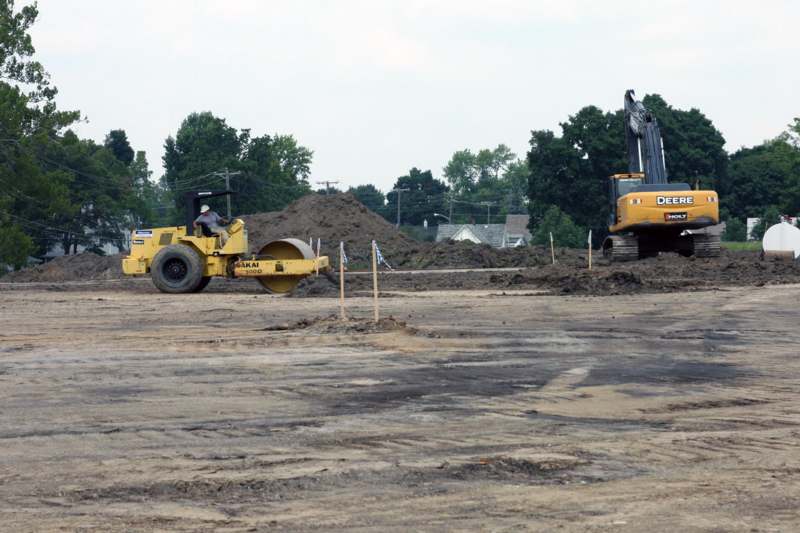 a construction site with a bulldozer and a bulldozer